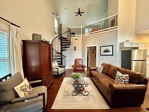 living area open to kitchen 
two bedrooms downstairs
Stairs leading to loft 1 BR