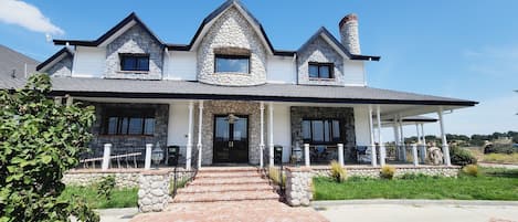 Entrance to this beautiful home on top of a scenic hll