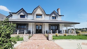 Entrance to this beautiful home on top of a scenic hll