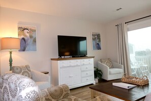 50" TV | Cable and Streaming | cabinet filled with books and games