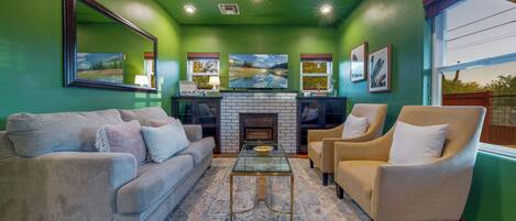 Living room with comfortable seating and smart TV (fireplace is nonfunctional)