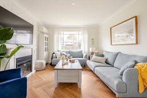 Main living area with TV, Netflix, Electric Fire Place, Puzzles & books