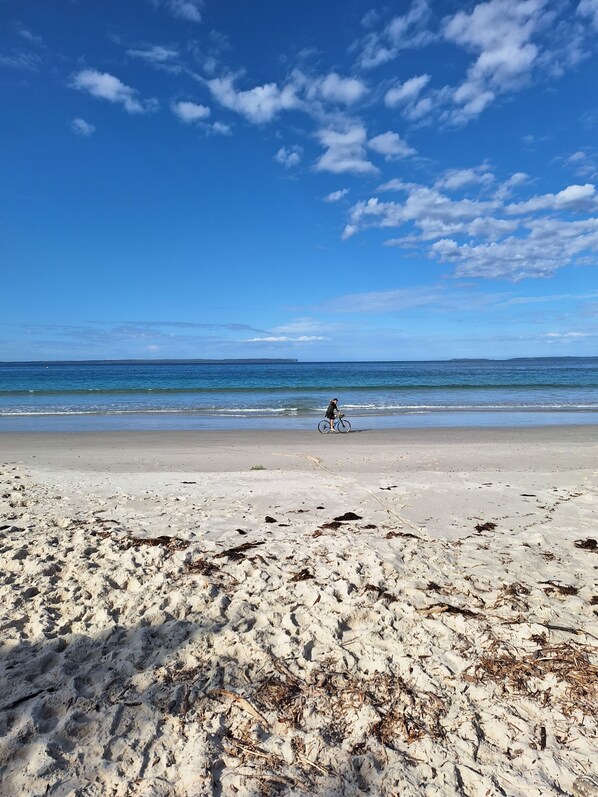 Beautiful white sand beach on the right and left of the property
