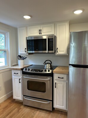 Updated kitchen with new or new appliances.