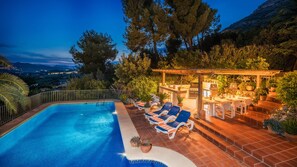 BBQ and pool by Night