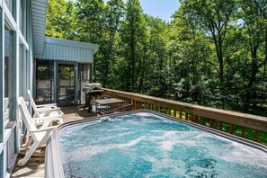 Huge deck with grill and hot tub