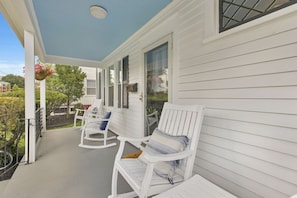 Four rocking chairs on front porch