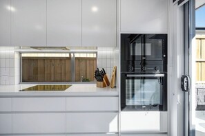 Modern well equipped kitchen. Including coffee machine and dishwasher.