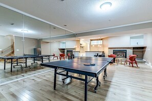 A foldable ping pong table with bats and balls for use during stay