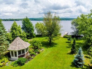 Large backyard with dock for lake access