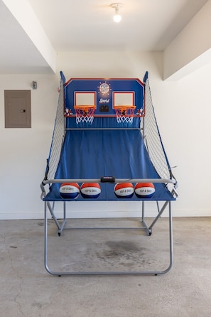 Headed to a Jayhawks game?! Get warmed up yourself on our basketball arcade game.  How many baskets can you make before time expires?  Plug the backboard into the nearby outlet and take on the different shooting games loaded into the system.  