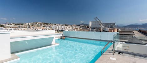 Take a dip in the rooftop pool with panoramic city views.