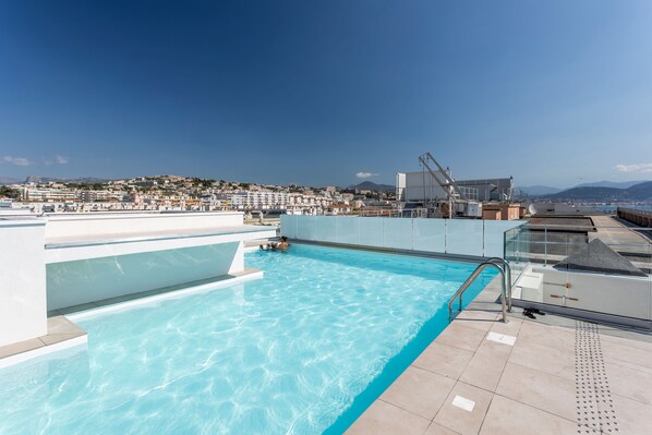 Take a dip in the rooftop pool with panoramic city views.