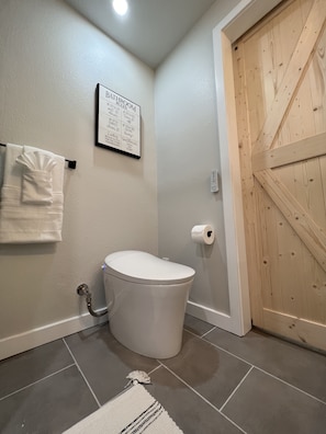 Smart toilet with built-in bidet, a warm seat, beloved by many of our guests.