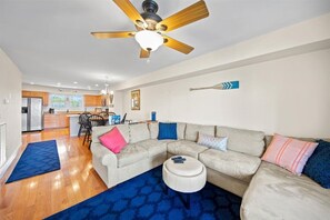 The spacious Living Area has a comfy Sectional with room for all.
