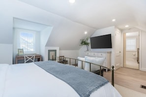 Experience ultimate comfort in our primary suite, boasting a king-sized bed with plush bedding and an ensuite full bathroom.