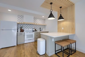 Fully stocked kitchen with complementary k cups, tea bags, creamers and sugar packets