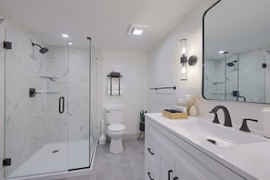 Full bath with walk in shower, towels and two robes are provided
