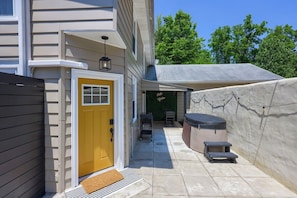 Front door and private courtyard area. The hot tub is available year round.