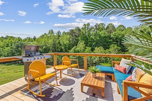 Inviting outdoor patio with colorful furniture and BBQ grill