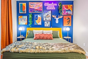 2nd Bedroom - Unwind in the embrace of a king bed with captivating art gallery