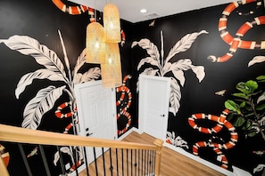 Step into the VIBRANT and welcoming home entryway immediately immersing you in the tropical surroundings of your home away from home.