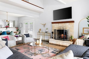 Step into a bright, modern living space with a cozy fireplace and open layout—perfect for relaxing and making memories. Book your stay today!