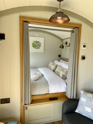 Inside the Longwool Shepherds Hut is the King Size Bed at one end