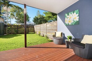 Private balcony, sitting area and fenced in private garden.