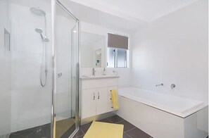 Large second bathroom on second floor. Full size tub and seperate shower