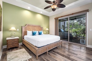 Main level primary bedroom with King bed, lanai access