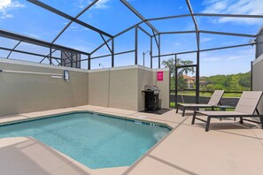 Amazing private pool of the townhouse in Kissimmee Florida - A peaceful atmosphere where you can relax and unwind - Sparkling waters beckoning you to take a leisurely swim - Comfy lounge chairs and BBQ for added convenience