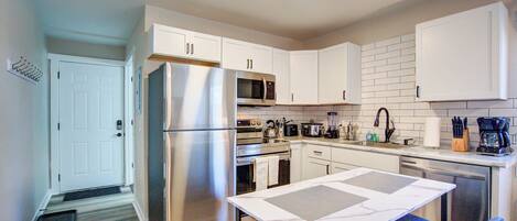 Kitchen with dishwasher and stainless steel appliances.