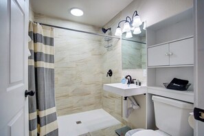 Bathroom with walk-in shower.