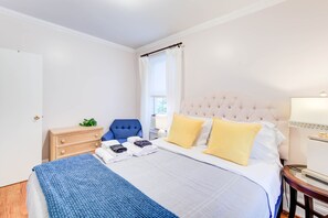 Immerse yourself in a dreamy ambiance in this cozy bedroom, adorned with elegant artwork that provides a window into Alexandria's rich past. A tranquil retreat from the lively city life just steps away.