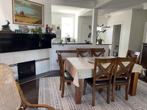 Standing in the living room looking into the Dining area and kitchen