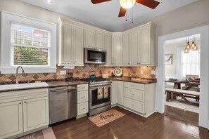 Gourmet kitchen includes stainless steel appliances, plenty of counter space and all the cooking essentials needed to entertain.