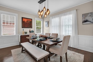 Natural light invites guests to enjoy breakfast or dinner in the formal dining room.  Dining room table seats 6 comfortably.