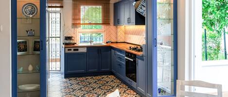 Our stylish American-style kitchen with blue tones and authentic mosaic tiles…