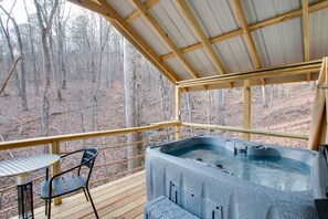Spacious glamping tent featuring a private hot tub, king bed, and scenic views. Experience luxury camping in the heart of North Alabama.