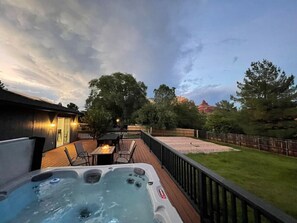 Enjoy the large yard from the relaxing hot tub