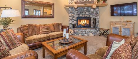 Living room with wood burning fireplace