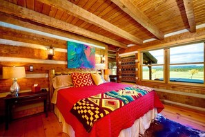 The luxurious king bed in the master with those amazing mountain views.