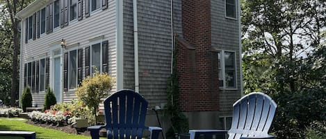 Front yard with fire pit and front entrance to house