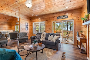 In this cabin, transition effortlessly from the cozy sofa and crackling fireplace, to the spacious terrace offering the most breathtaking views of the Smoky Mountains.