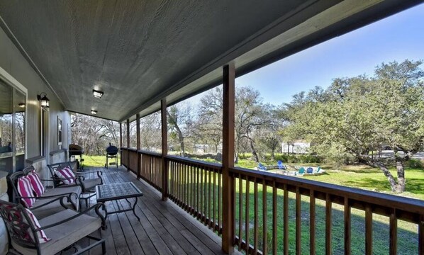 Covered deck overlooking the front yard.