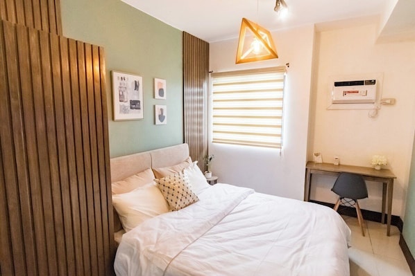 Queen size bed, cabinet (left). There’s also a study nook (right)