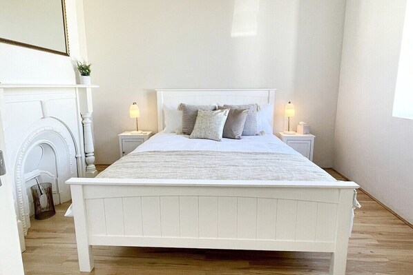 Main Bedroom with queen bed and quality linens and towels