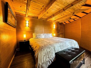 The master bedroom features a luxurious king-size bed