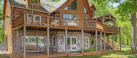 Lakeside serenity awaits at this rustic log cabin
